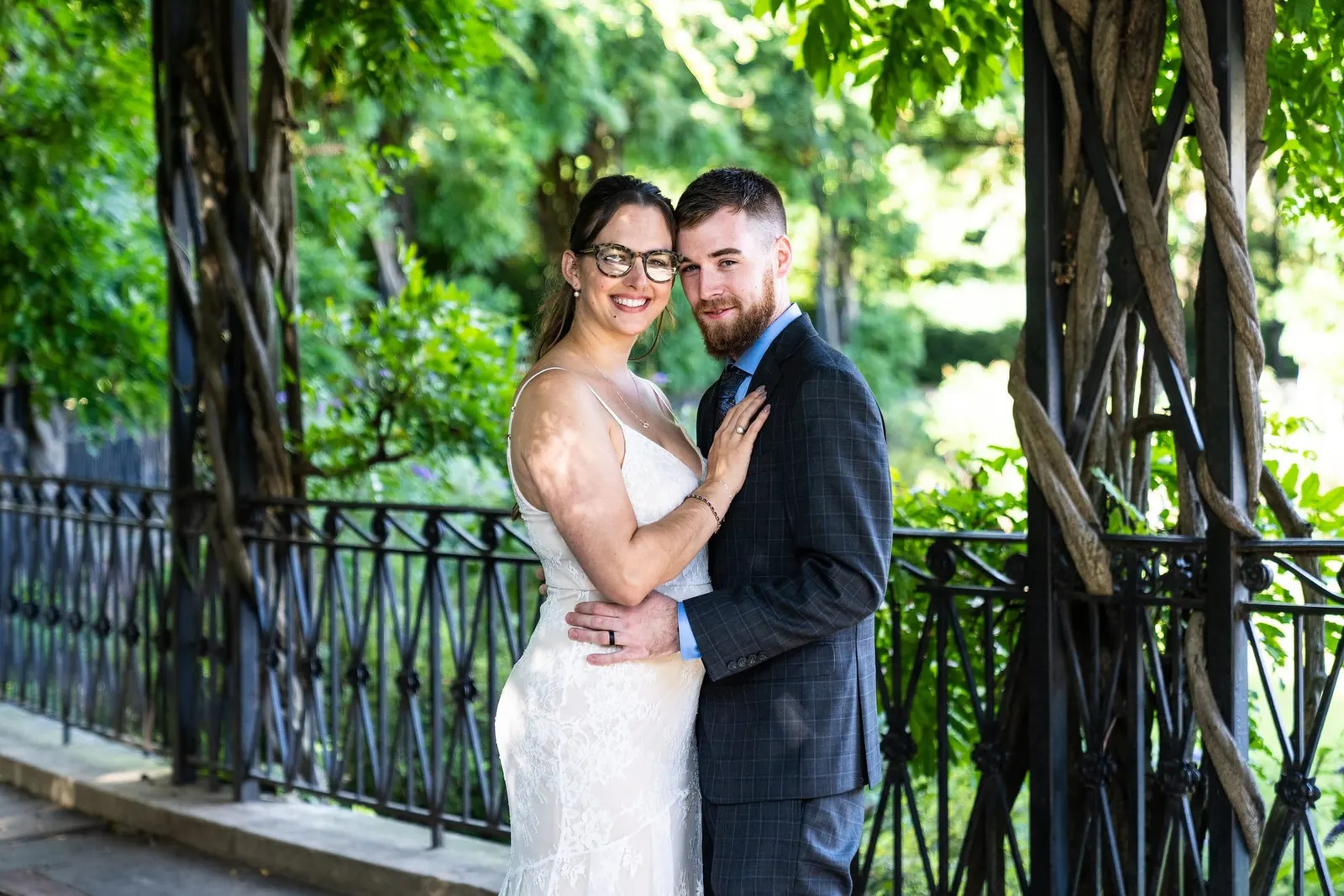 central park conservatory garden bride and groom embracing for photo